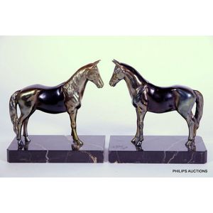 A pair of Art Deco spelter horse bookends, circa 1930, standing…