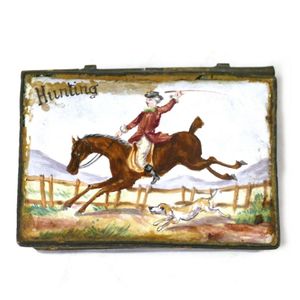 A Victorian enamel vesta case, decorated with a hunting scene…