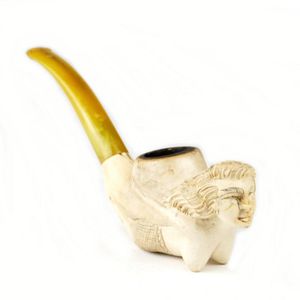 An old Meerschaum pipe, amber mouthpiece, the bowl in the form…