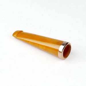 An early 1900s amber cigar holder with a 9ct. rose gold band to…