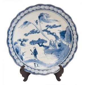 A Japanese blue and white charger, late 18th century, decorated…