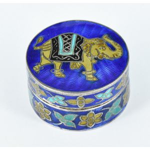 A sterling silver and enamel pill box, the lid featuring an…