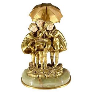 A Dimitri Chiparus gilt chryselephantine figural group of…