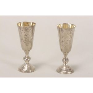 Two Latvia silver kiddush cups, with narrow tapering bowls on…