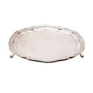 A sterling-silver salver with a pie-crust rim on feet,…
