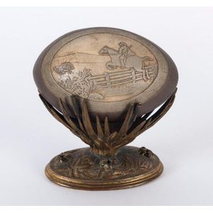 An Australian carved emu egg with emu hunt scene on gilt metal…