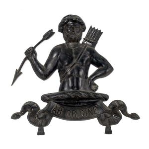 A cast iron wall mount depicting a native warrior holding a…