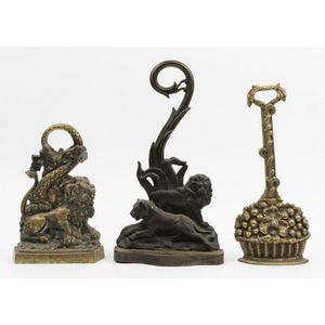 Three cast brass door stops, circa 1860 and later, including…