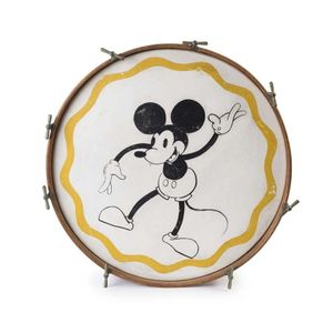 A bass drum decorated with an early Mickey Mouse motif, circa…