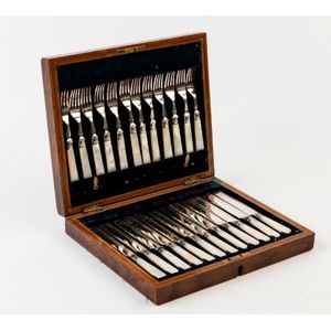 A set of twelve mother-of-pearl handled fruit knives and forks,…