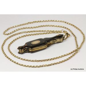A lovely antique pair of lorgnettes on muff chain, rolled…