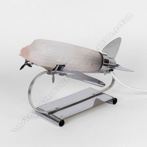 A reproduction Art Deco chrome and pink glass aeroplane desk…
