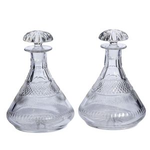 A pair of Edwardian cut glass Ships' decanters, with mushroom…
