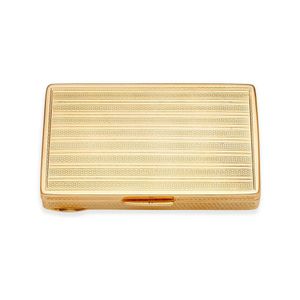 A gold card box, of rectangular form with engine turned…