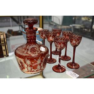 Seven piece red flash glass liqueur set, approx 18 cm high and…
