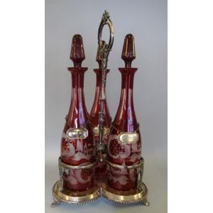 Large vintage 3 bottle tantalus, with ruby flashed glass…