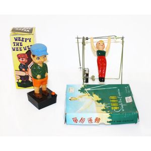 2 plastic and celluloid toys, including Single bar exercise…