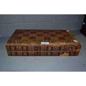 Vintage backgammon board game box in the form of two old books.…