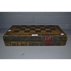 Vintage backgammon board game box in the form of two old books.…