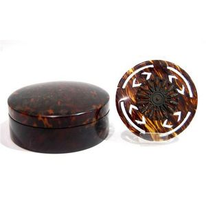 A circular covered tortoiseshell box, & a tortoiseshell carved…