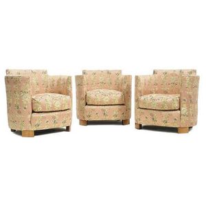 A set of three Art Deco silk upholstered tub chairs of compact…