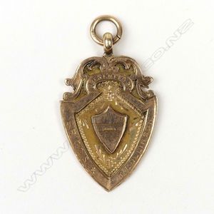 A 9ct. rose gold 1912 Auckland Rowing Club fob medallion,…