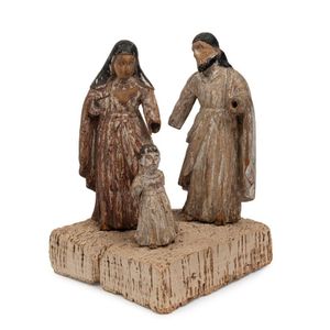An antique figural group depicting Mary, Joseph and young Jesus,…