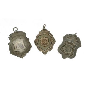 Three Australian fob medallions. One plain, and two with…