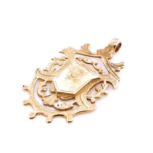 Yellow gold fob medal un engraved and unmarked. Approx size 41…