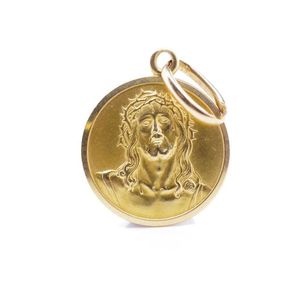18ct yellow gold medal of Jesus of marked 750. Approx dia. 13…