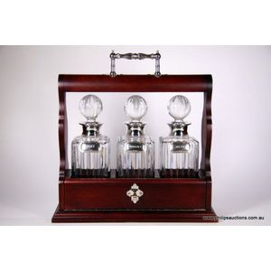 A sterling silver and crystal tantalus, with wine labels,…