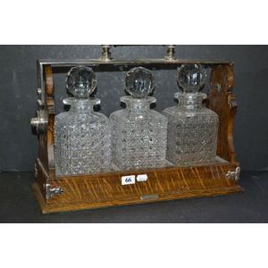Quality three bottle oak, silver plated and crystal tantalus by…