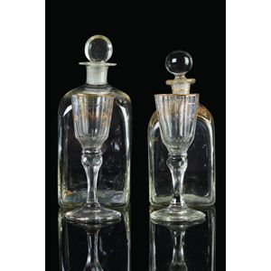 Two early-19th century French liqueur decanters and glasses,…