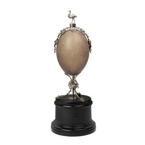 A Colonial silver mounted emu egg on ebonised stand, 19th…