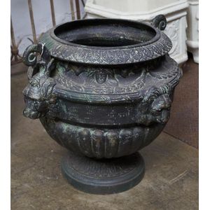 An early 20th century cast iron planter, lion head decoration,…