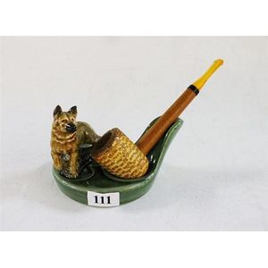 A Wade pipe and holder, with German shepherd applied figure. C.…