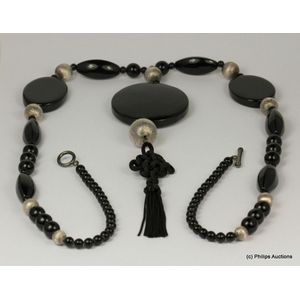 A silver and onyx set necklace, Art Deco styled as a long line…