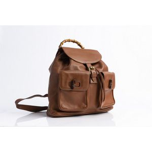 A backpack by Gucci, styled in brown leather with bamboo and&hellip;