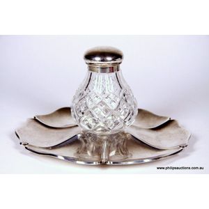 A Victorian sterling silver topped crystal bottle Upon a tray,…