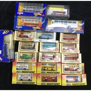 A collection of Die cast vintage Buses, Tow Trucks, fire Trucks,…