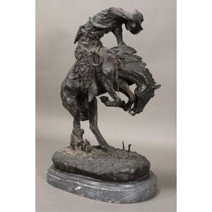 Large bronze figure of a Horseman, after Remington, depicting a…