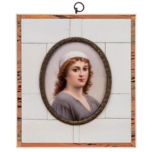 A Continental oval portrait miniature on porcelain in a piano…