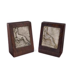 A pair of Art Deco gazelle bookends, cast metal and timber,…