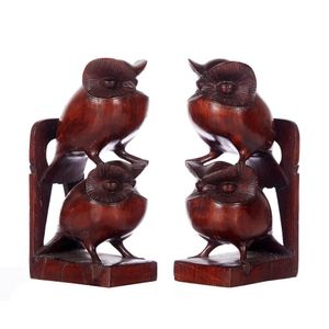 A pair of carved mulga wood bookends, each carved as a stylised…