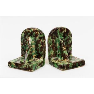 A pair of Bosley ware bookends, each modelled in gothic style,…