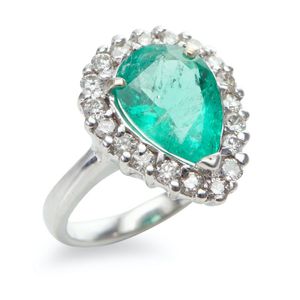 A Colombian emerald and diamond ring, featuring a pear cut…