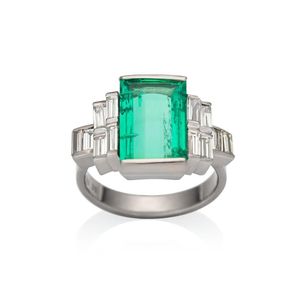 18ct white gold, emerald and diamond ring, circa 1960. centring…