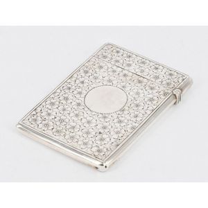 A Victorian sterling silver card case, with light engraving of…