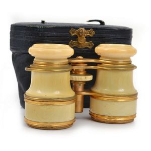 A pair of Victorian opera glasses housed in leather case,…