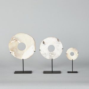 Three Melanesian discs of Tridacna shells (Tridacna gigas),…